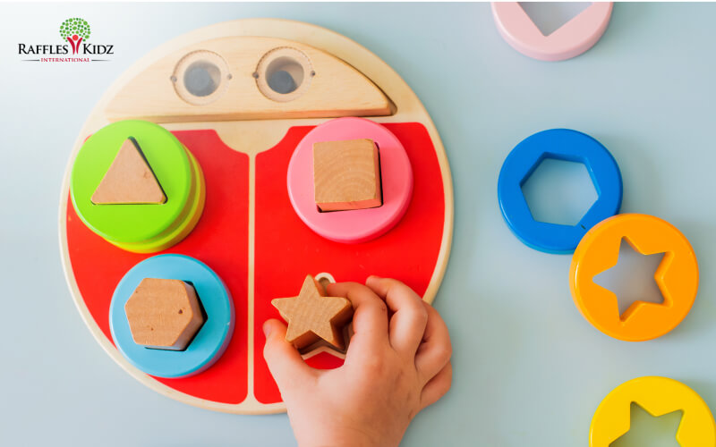 toddler playing with wooden blocks