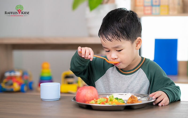 A child eating a healthy meal.